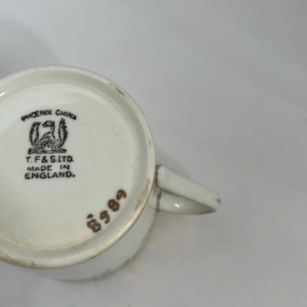 TF& S LTD, DEMITASSE CUP AND SAUCER
